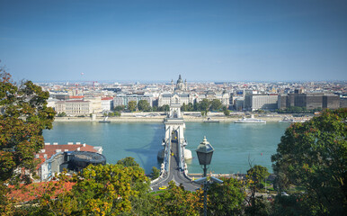 Wall Mural - Budapest from above. Wide angle photo with the cityscape of Budapest, capital city of Hungary, during a sunny summer morning. Travel to Budapest, view to bridges and Danube river.