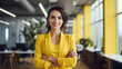 © FutureStock - Young happy pretty smiling confident business woman   in yellow shirt on modern office background