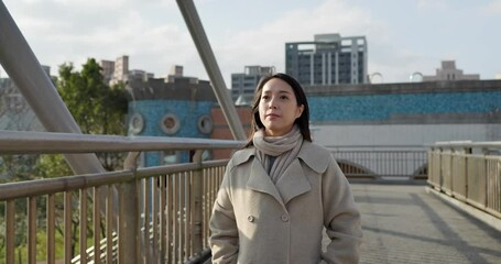 Poster - Woman with winter jacket and walk in the city