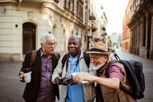 Senior Tourists Share A Joyful Moment On A City Street