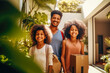 Portrait of young African American family moving house.
