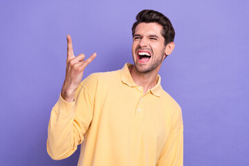 Poster - Photo of overjoyed carefree person scream arm fingers demonstrate heavy metal symbol isolated on violet color background