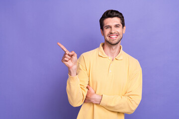 Sticker - Portrait of friendly cheerful person beaming smile indicate finger empty space blank isolated on purple color background