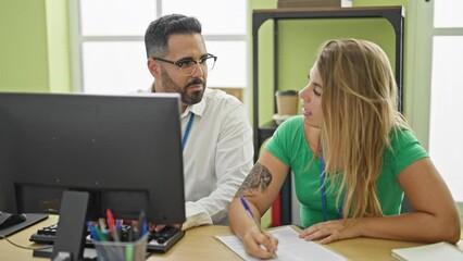 Canvas Print - Man and woman business workers working high fiver with hands raised up at office