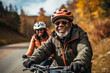 © Georgii - Happy adult laughing african american couple with big smiles riding bikes down the street