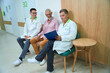 © Svitlana - Doctors communicate with an elderly man in a hospital corridor