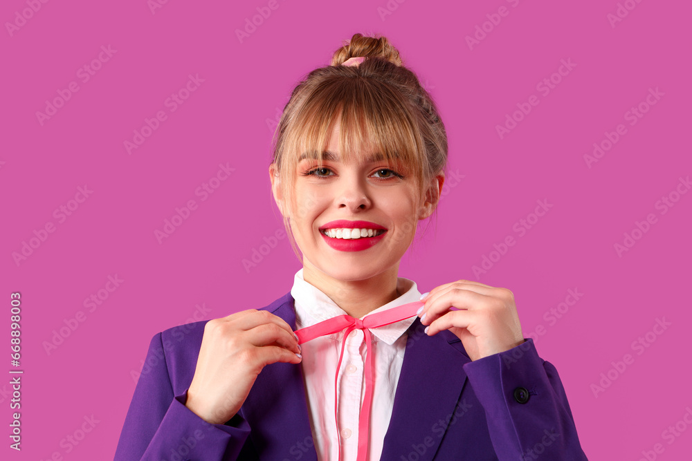 Young woman dressed as doll on purple background, closeup