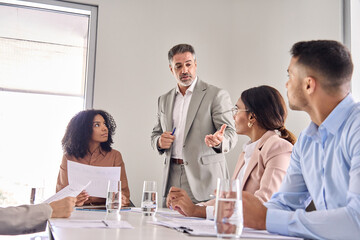 Aufkleber - Senior company leader manager consulting busy company employees business people managing international workers team discussing project plan at business group meeting in office boardroom.