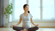 © Doraway - Pregnant woman in Asia doing maternity yoga