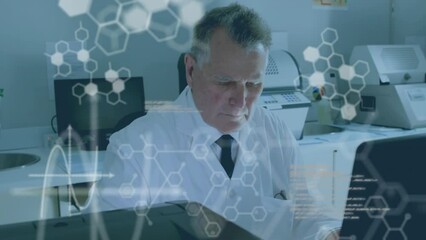 Canvas Print - Animation of medical data processing over caucasian male scientist using a computer at laboratory