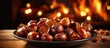 Tasty roasted chestnuts on a wooden surface