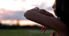 Young Beautiful Hippy Woman Dancing In Field At Sunset - Close Up On Arms