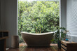 © Wavebreak Media - Modern bath by huge window with view on trees in sunny bathroom