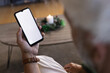 © Wavebreak Media - Senior caucasian man sitting on sofa using smartphone with copy space on screen at home