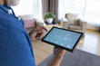 © Wavebreak Media - Midsection of senior caucasian man using tablet with smart home interface