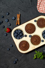 Wall Mural - Freshly baked muffins with fresh berries