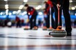 Curling stones and competitors