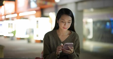 Poster - Woman use of mobile phone in city at night