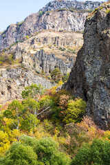 Sticker - colorful rocks in river gorge near Geghard in Armenia on sunny autumn day