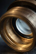 © Yura Borisov - Brass elements of an old lens close-up. Shiny metal surface.