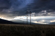 Power lines across the landscape with dramatic sky