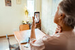 © Marko Geber - Elderly woman consulting with her doctor via a virtual telehealth session