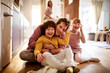 © Geber86 - Happy dad playing with his kids on the floor