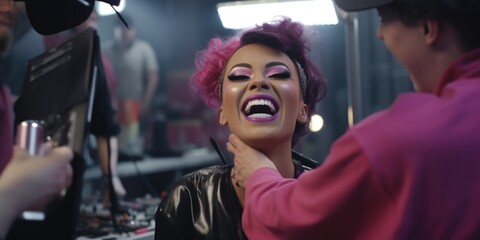 A woman with pink hair is getting her make-up done. This image can be used for beauty and fashion related content