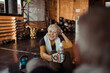 © Davor - Radiant senior woman taking a refreshing break during her gym session