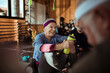 © Davor - Joyful seniors sharing a light moment during their workout session