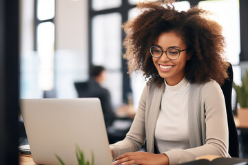 The portrait of a female business woman with an Afro hairstyle working on a laptop in the co-working space of the office. Generative AI.