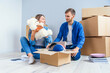 © gorynvd - Young couple unpacking things after moving into new house