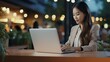 © medienvirus - Young asian business woman using digita tablet and working on laptop computer at modern office.