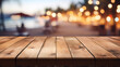 empty wooden table with blurry beach bar background