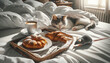 Funny morning home scene in the bedroom with a cat and mouse. Breakfast in bed for everyone