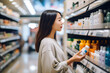 © lucky pics - young adult Asian woman choosing a product in a grocery store. Neural network generated image. Not based on any actual person or scene.