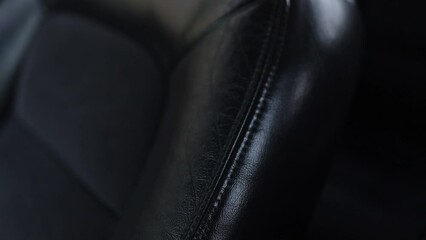 Wall Mural - luxury black leather seats in the interior of a business car close-up.