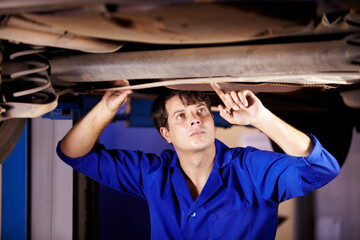 Poster - Car, inspection or service with an engineer man in a garage for a report on a vehicle repair for insurance. Maintenance, professional and expertise with a young mechanic in a workshop for assessment