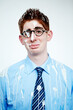 © Mariusz S/peopleimages.com - Portrait, bird poo and a business man in studio on a white background for an unlucky or misfortunate mishap. Sad, depression and bad luck with an unhappy young employee in glasses after an accident