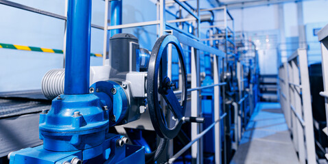 Banner industry waterworks. Closeup valve of blue taps for drinking water pipeline for city service