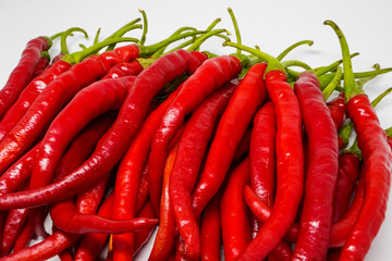 Wall Mural - Red Chili Curly is one of the most widely grown and sold red chili varieties in Indonesia. Ingredient, including making chili sauce. Chili peppers (also chile, chile pepper, chilli pepper, or chilli).