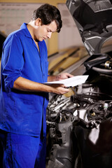 Poster - Paperwork, man and mechanic reading at engine of car, repair and maintenance. Checklist, technician and serious person on motor vehicle hood, inspection list and fix transport at auto service garage