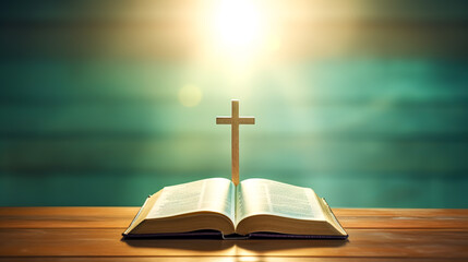 Wall Mural - Open holy book Bible on a green background with a glowing cross.