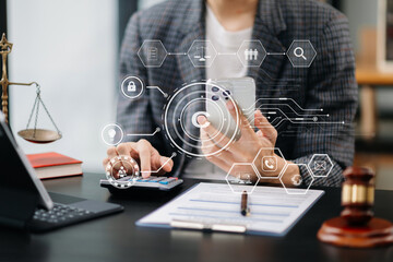 Wall Mural - Copyright or patent concept, Person hand using laptop computer, tablet and smartphone with virtual screen copyright icon trademark, Creation ownership against piracy. at office.