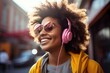 Beautiful girl with curly hair on the street with pink headphones listening to music