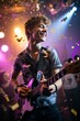 © Isabel - Portrait of young man playing on electric guitar in nightclub with confetti