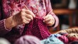 © Nicolas Swimmer - An elderly woman knits Christmas gifts for her grandchildren