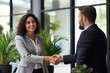 © Hope - Happy mid aged business woman manager handshaking at office meeting. Smiling female HR hiring recruit at job interview, bank or insurance agent, lawyer making contract deal with client at work.