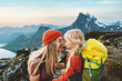 Family travel lifestyle mother hiking with daughter child outdoor active vacations backpacking in mountains parent and kid together tenderness and care