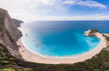 Aerial beautiful beach and water bay in the greek spectacular coast line. Turquoise blue transparent water, unique rocky cliffs, Greece summer top travel destination Lefkada island